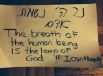 This is the sign that I carried tonight, a quote from Proverbs 20:27, "The breath of the human being is the lamp of God," followed by "I can't breathe."